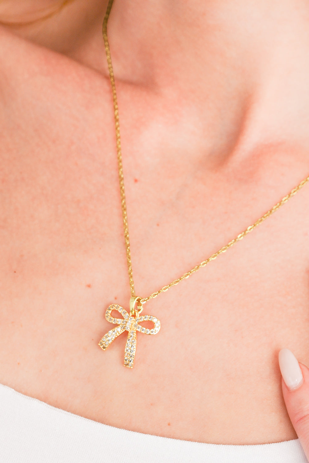 Golden Glimmer Bow Necklace