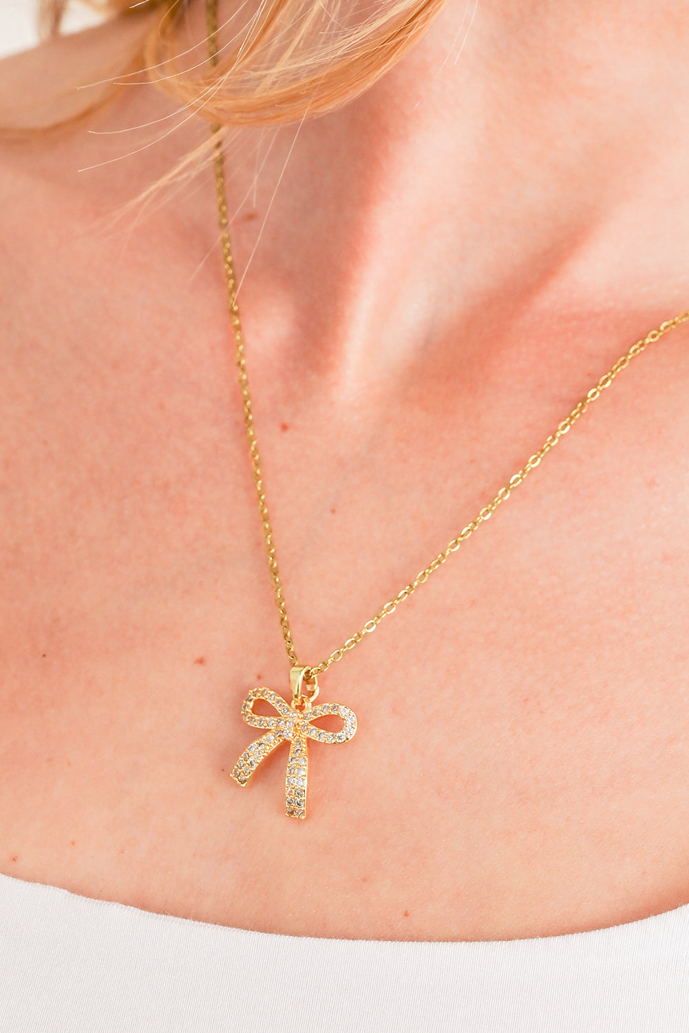 Golden Glimmer Bow Necklace