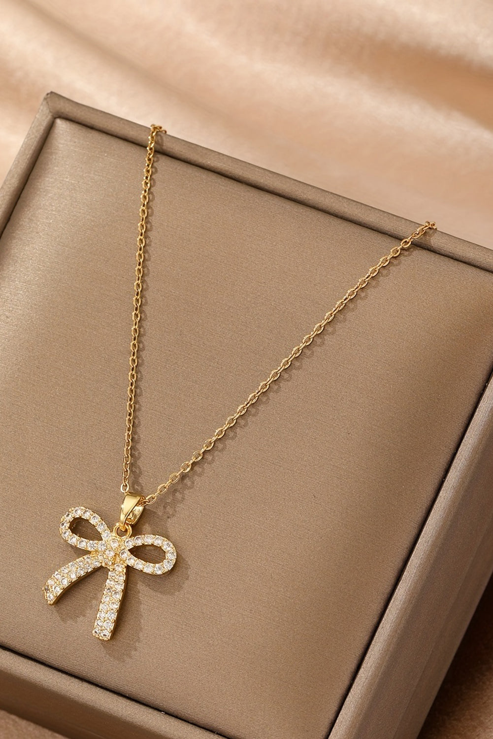 Golden Glimmer Bow Necklace