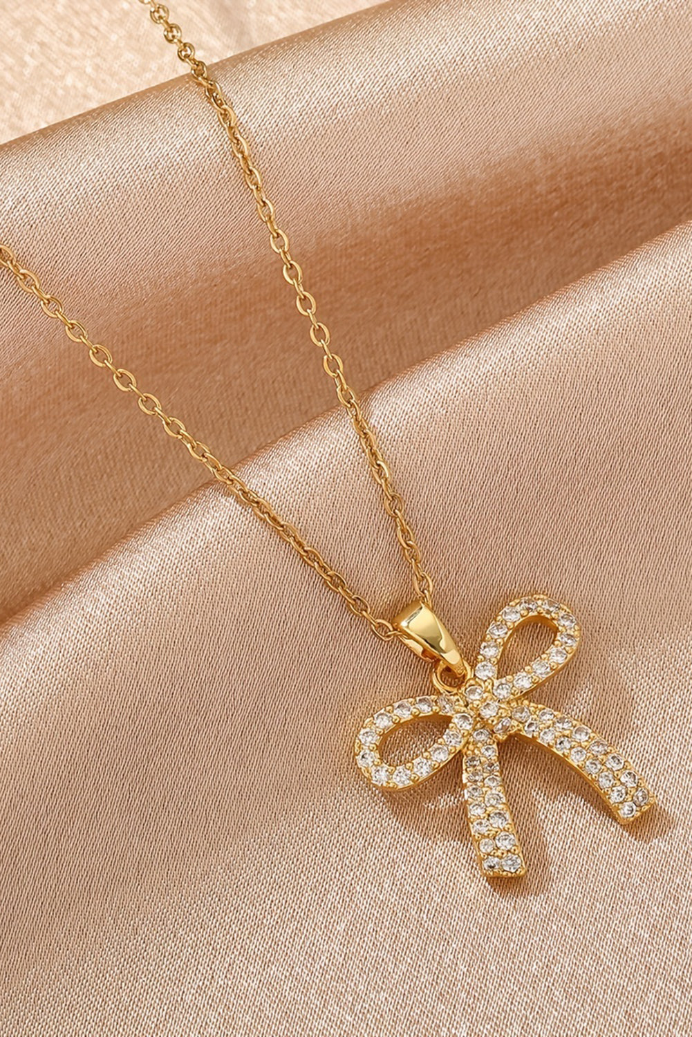 Golden Glimmer Bow Necklace